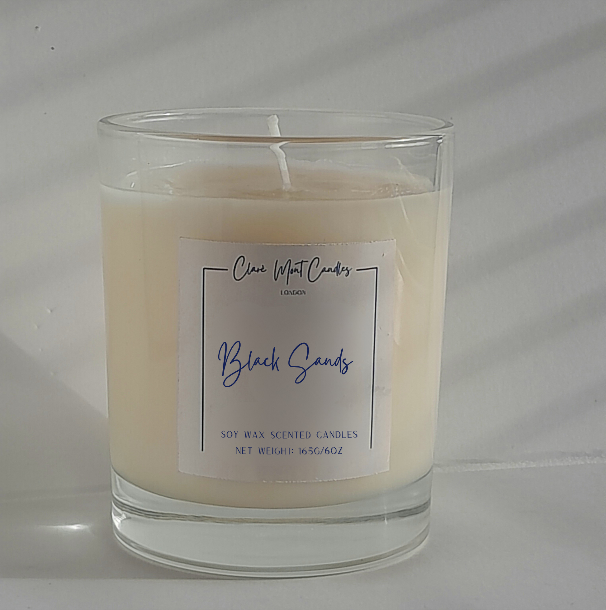 Candle with a label on a white background
