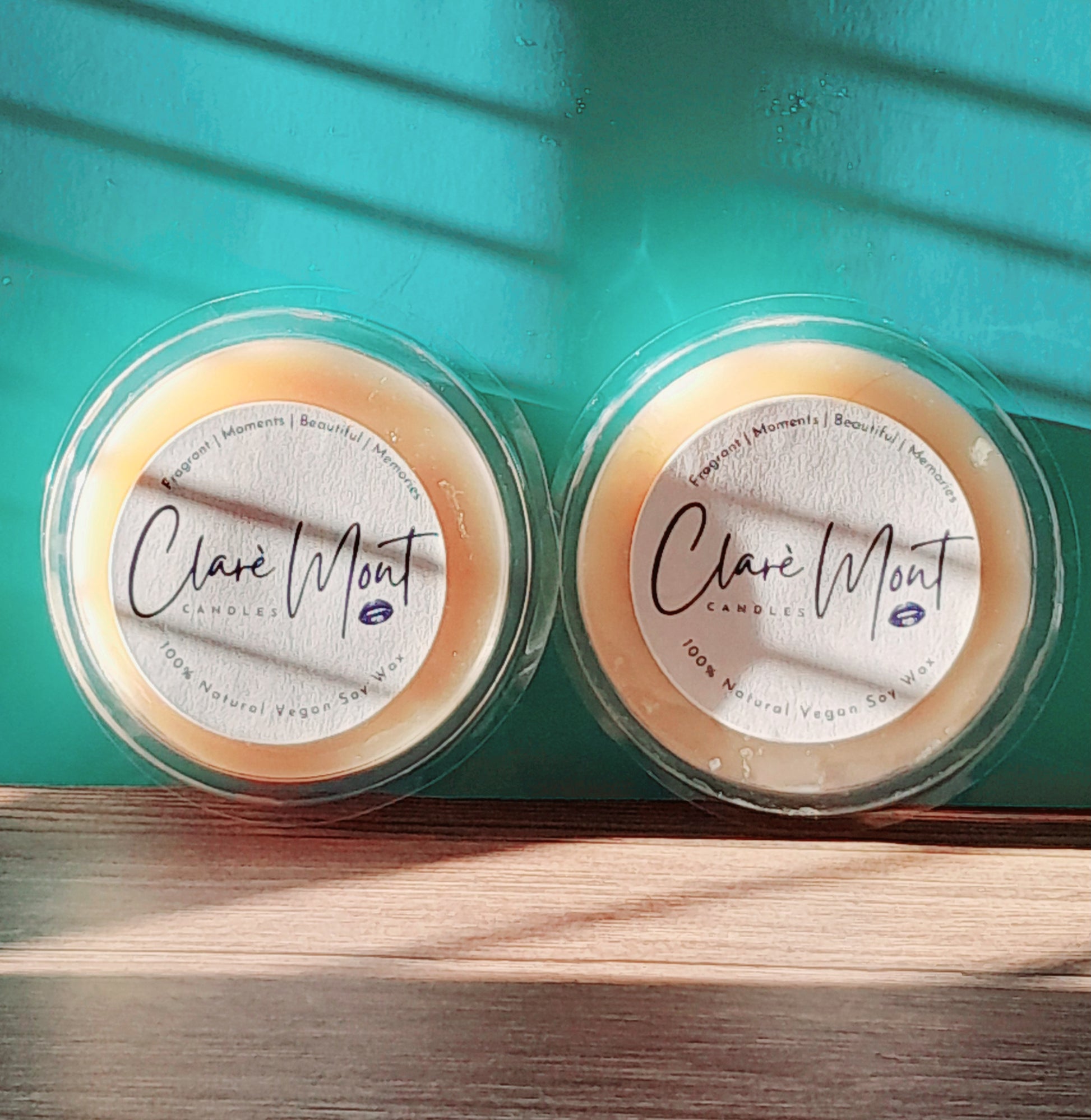 Two Fragrane Discovery Rounds against a green background - Try before you buy