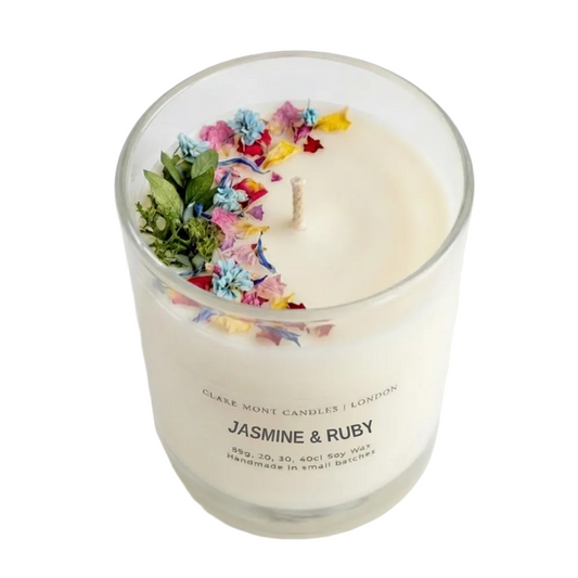 Jasmine & Ruby hand poured Clare' Mont Candle with floral elements in a glass jar on a white background