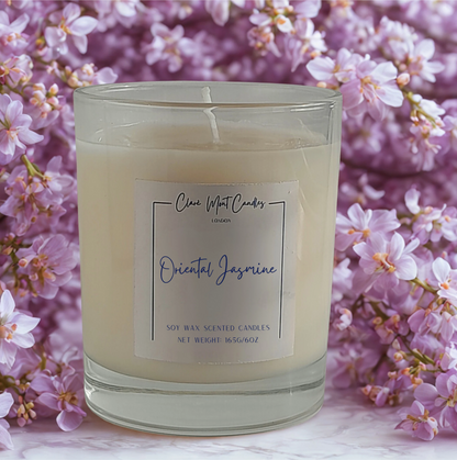 Candle labeled 'Oriental Jasmine' with a floral background