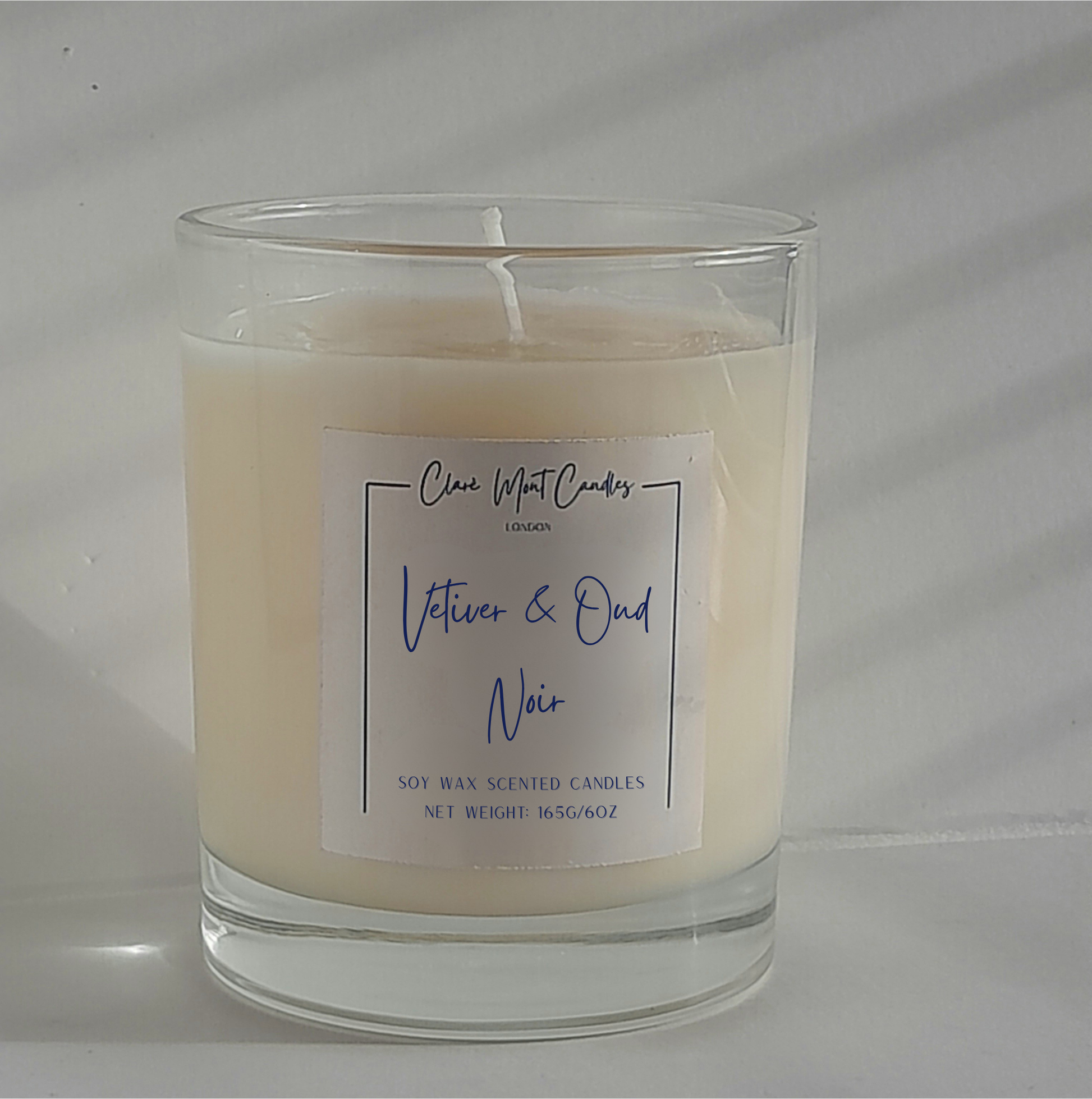 Candle with a label on a white background